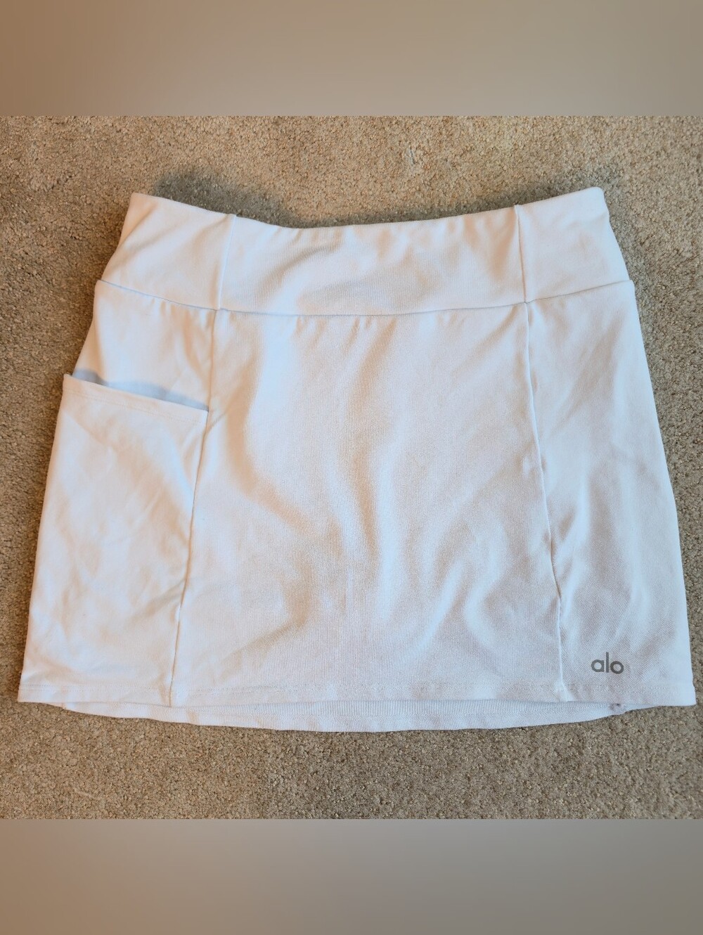 White athletic tennis skort by Alo Yoga